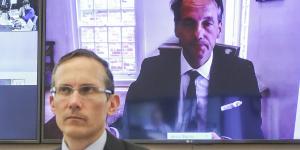 ASIC chair James Shipton appearing via teleconference on Friday,and Labor MP Andrew Leigh (in foreground).