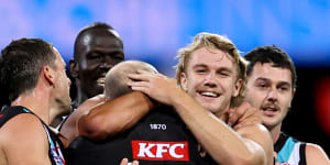 Hinkley celebrates with his players after the win over Sydney in round four.