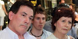 The parents of Brodie Panlock,Damien (left) and Rae Pancock and their son Cameron (centre),speak to reporters as they leave the Melbourne Magistrate court. The parents of Ms. Panlock,who killed herself after being subjected to relentless workplace bullying,says the law should be changed to allow courts to jail tormentors.