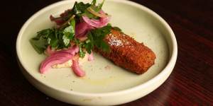 Crumbed pork terrine with pickled onion,gribiche,preserved lemon and parsley salad.