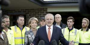 Minister Michaelia Cash and Prime Minister Scott Morrison with tradies in April 2019.