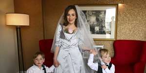 Stella Moris is photographed in her Vivienne Westwood dress,with her sons Max,3,and Gabriel,4,before driving to Belmarsh Prison to marry Assange.