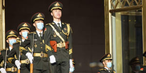 Members of the People’s Liberation Army (PLA) march outside the Great Hall of the People in Beijing on Wednesday. China also has devoted billions to its military.
