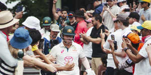 David Warner walks out to bat for the final time in Test cricket.