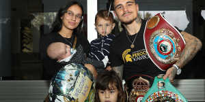 Kambosos with wife Rebecca and their three children. She quit university to help him follow his boxing dreams. 