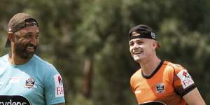 Wests Tigers coach Benji Marshall shares a light moment at training with his possible heir apparent Lachlan Galvin.