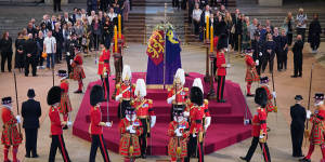 The first members of the public pay their respects as the vigil begins around the coffin of Queen Elizabeth II as it lies in state inside Westminster Hall.