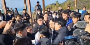 South Korea opposition leader stabbed in neck by man ‘wanting autograph’