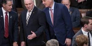 Ex-House Republican Leader Kevin McCarthy confers with Minority Whip Steve Scalise,left,before Ukrainian President Volodymyr Zelensky speaks in December.