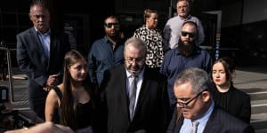 Brett Button,the driver of a charter bus that rolled and killed 10 weddings guests in the Hunter Valley,stands with head bowed as his lawyer reads an apology in Newcastle.