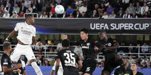 Real Madrid goalscorer David Alaba soars above the Frankfurt defence in Helsinki.