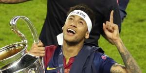 Neymar celebrates with the Champions League trophy after the final between Juventus and Barcelona at the Olympic stadium in Berlin in 2015.