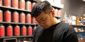 Tea server Roger Sam prepares a cocktail at Ms. Cattea. 