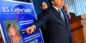 Geoffrey Berman,US attorney for the Southern District of New York,details the new charges,while standing next to a poster displaying the image of fund manager Jeffrey Epstein last week.