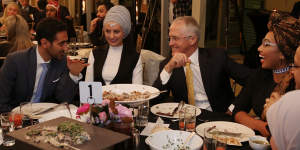 Waleed Aly (left) with his wife,Susan Carland (second left) attend Prime Minister Malcolm Turnbull's 2016 Iftar dinner.