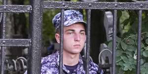 Russian Rosguardia (National Guard) servicemen guard the Porokhovskoye cemetery after a memorial service for mercenary chief Yevgeny Prigozhin,who was killed in a plane crash last week,in St. Petersburg.