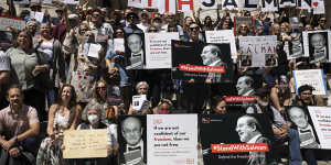 A group of writers and supporters gather in solidarity with Salman Rushdie outside the New York Public Library,a week after he was attacked and seriously injured.