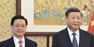 Hong Kong CEO John Lee (left) with Chinese President Xi Jinping:the city’s proposed counterespionage laws are echoing those of the mainland. 