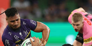 Melbourne’s Eli Katoa is tackled by the Panthers defence last season.