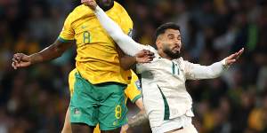 Jason Geria leaps for a header against Saudi Arabia.