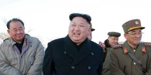 Kim Jong-un,centre,smiles during a missile launch in March.