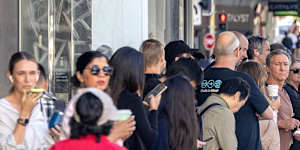 Commuters queue for a B-line bus at Dee Why on Monday morning.