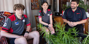 Barker College students Oliver Porter and Jiaqi Wan with robotics teacher Jeser Mross Becker safely back at the school.