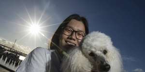 Angel Wang,23,moved into the Docklands apartment she purchased for her and pooch Hong Bao three months ago.