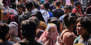 Indonesians crowd the Tanah Abang textile market to buy new clothing,a tradition for upcoming the Eid al Fitr holiday in Jakarta,Indonesia.