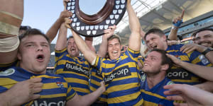 Champs again:Sydney University celebrate back-to-back titles after a come-from-behind win over Warringah.