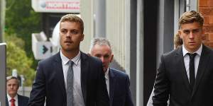 Callan Sinclair (right) arrives at the NSW District Court in Wollongong on Wednesday.
