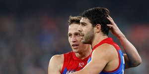 Jack Billings congratulates Christian Petracca on one of his five goals against the Blues.