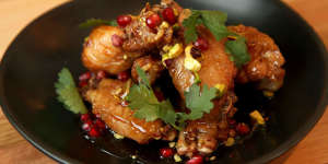 Twice-cooked chicken wings with pomegranate glaze and pistachios.