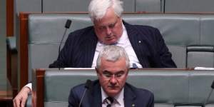 Clive Palmer rests his eyelids during question time,sitting behind fellow crossbench MP Andrew Wilkie.