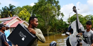 Residents recover whatever goods they can.