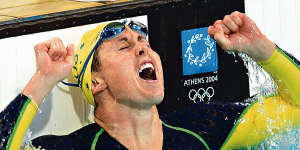 Petria Thomas celebrates after winning a gold medal in the 100-meter butterfly at Athens Olympic Games.