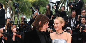 Reedus and his wife,the German actress and model Diane Kruger,walk the red carpet at Cannes in May 2022.