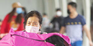 Passengers leaving the Sydney International Airport on Saturday. The coronavirus outbreak has gutted international travel demand. 