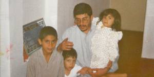From left:Sami,his brother Ali,his father and his sister Mona at home in Iran’s Khuzestan Province.