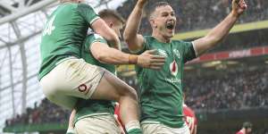 Ireland’s Jonathan Sexton,right celebrates with Ireland’s Andrew Conway,left and try scorer Ireland’s Garry Ringrose,after Ringrose scores a try,during the Six Nations rugby union match between Ireland and Wales at the Aviva stadium.