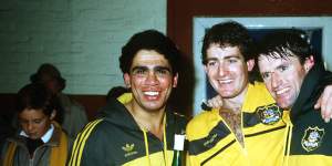 Mark Ella,David Campese and Andrew Slack celebrate after beating Scotland,and winning the Grand Slam.