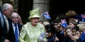 Queen Elizabeth greets students from St Andrews School on a visit to Australia for the 2006 Commonwealth Games.