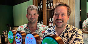 Rob Turner (left) and Justin Lestal at The Exchange Bar and Grill in Warsaw. The Australians are two of the bar’s co-owners.