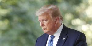 US President Donald Trump arrives at a news conference in the Rose Garden of the White House in Washington,DC. 