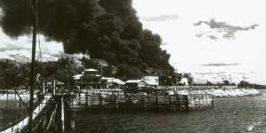 Burning oil tanks following Japanese raid on Darwin,1942