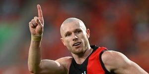 AFL cautions Essendon over killer’s visit to change rooms after game