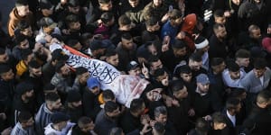 Palestinians carry the body of man who was killed in the clashes.