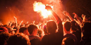 Flares are thrown at Federation Square during the World Cup in 2022.