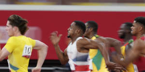 Rohan Browning,left,of Australia,leads the field in his heat of the men’s 100m.