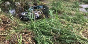 Drivers swept off flooded Queensland roads as west cops drenching